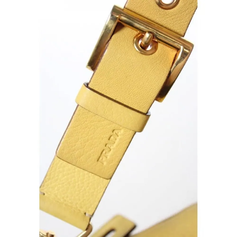 Vintage 90s Prada, yellow grained leather, hobo-style satchel with top zip, gold hardware, & padlock/keys